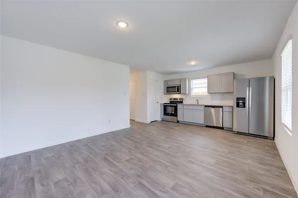 a view of kitchen with wooden floor