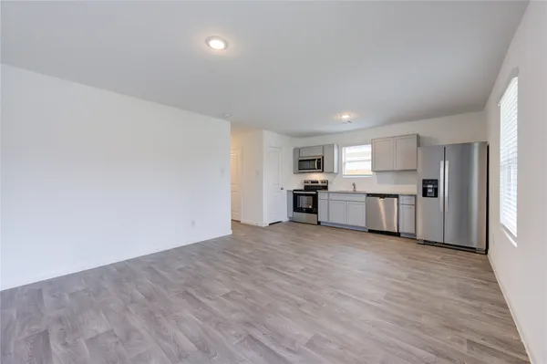 a view of kitchen with wooden floor