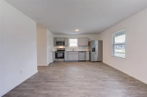 a view of a kitchen with a sink cabinets and a window