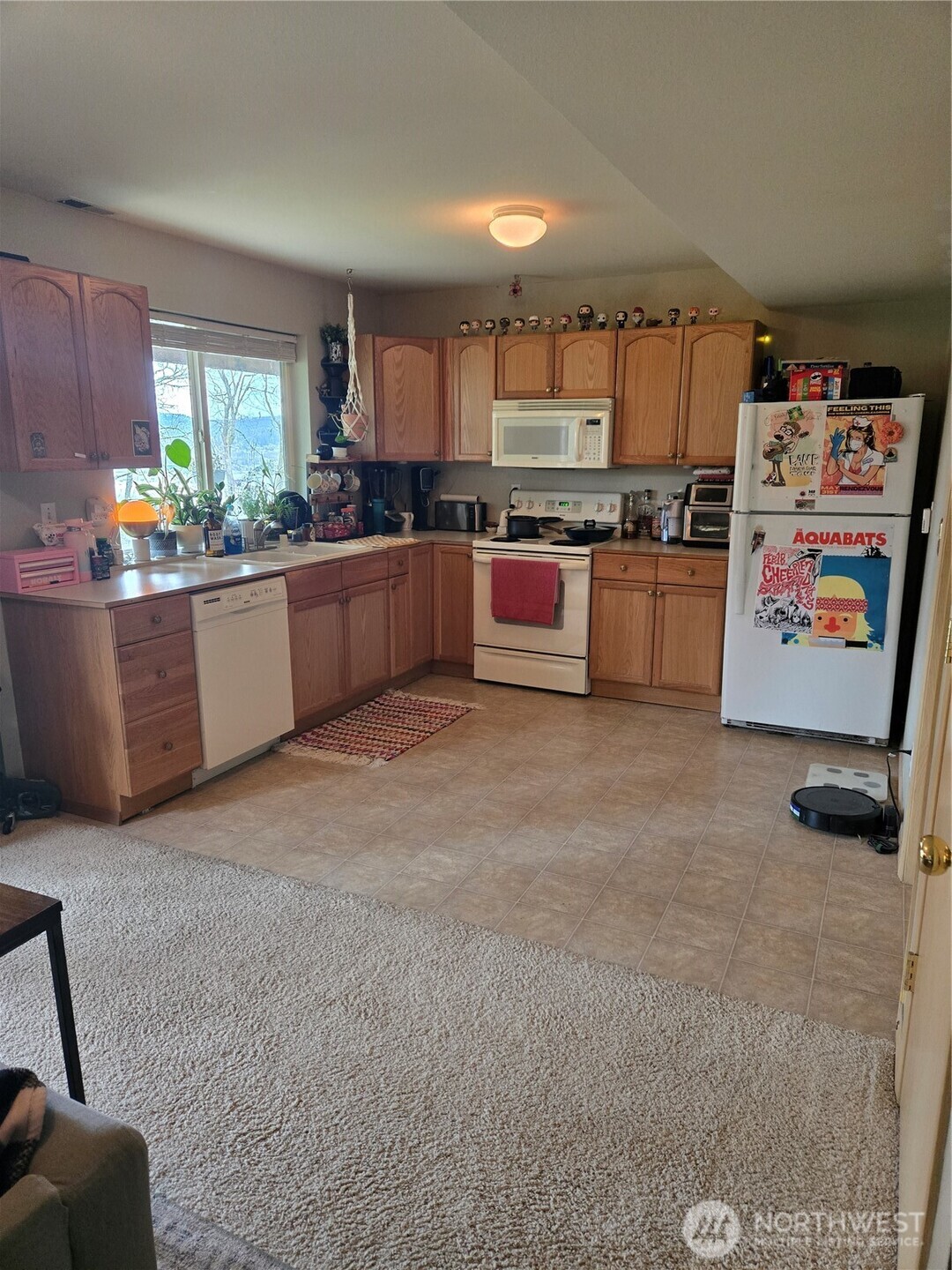 600 Northwest 3rd Court Renton, WA 98057 - Photo 19 of 28 a large kitchen with stainless steel appliances kitchen island granite countertop a sink and cabinets
