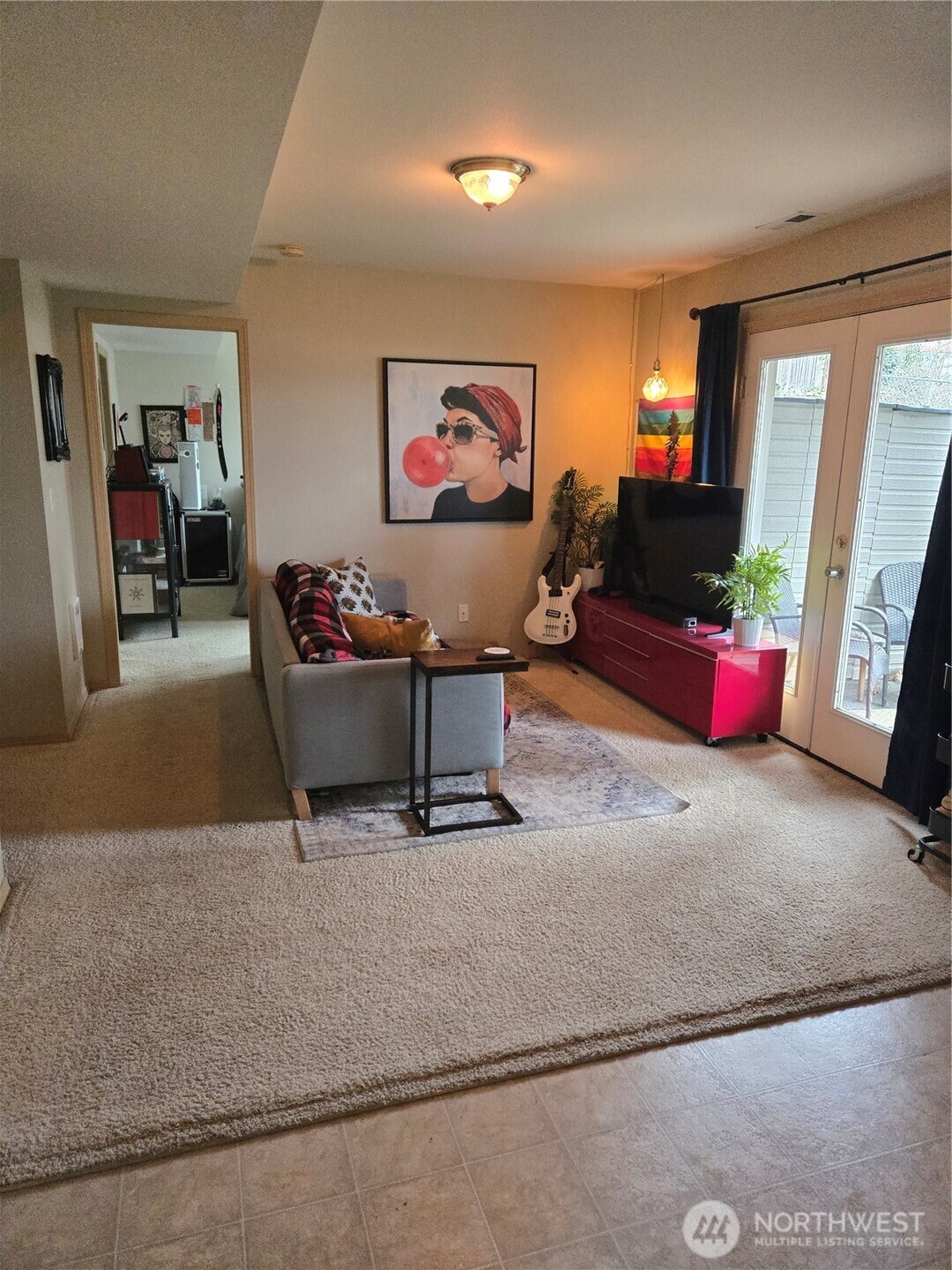 600 Northwest 3rd Court Renton, WA 98057 - Photo 20 of 28 a living room with furniture and a flat screen tv