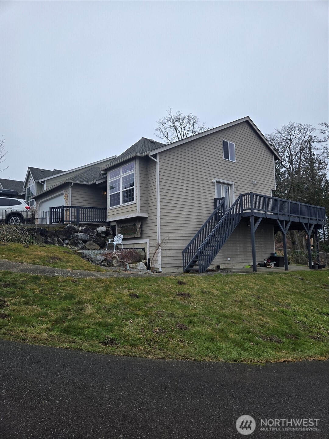 600 Northwest 3rd Court Renton, WA 98057 - Photo 2 of 28 a view of a house with a yard and sitting area