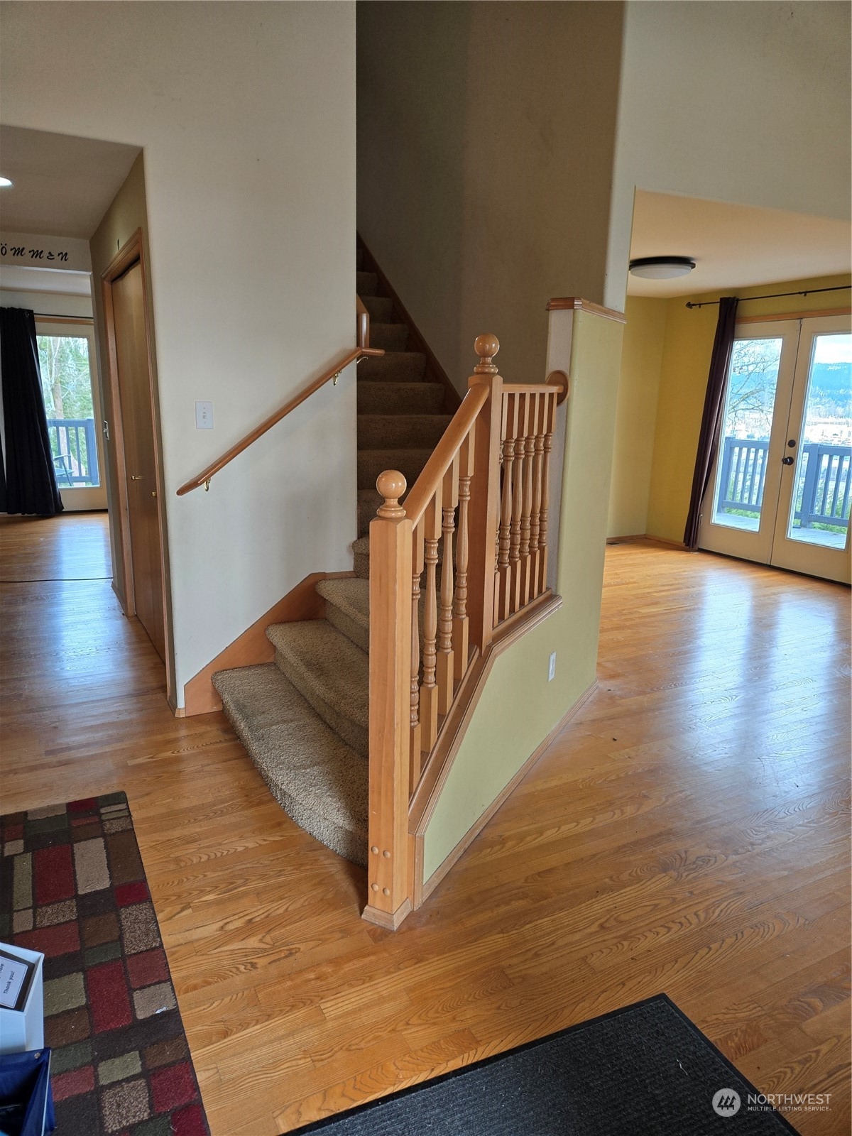 600 Northwest 3rd Court Renton, WA 98057 - Photo 3 of 28 a view of a hallway with wooden floor and staircase