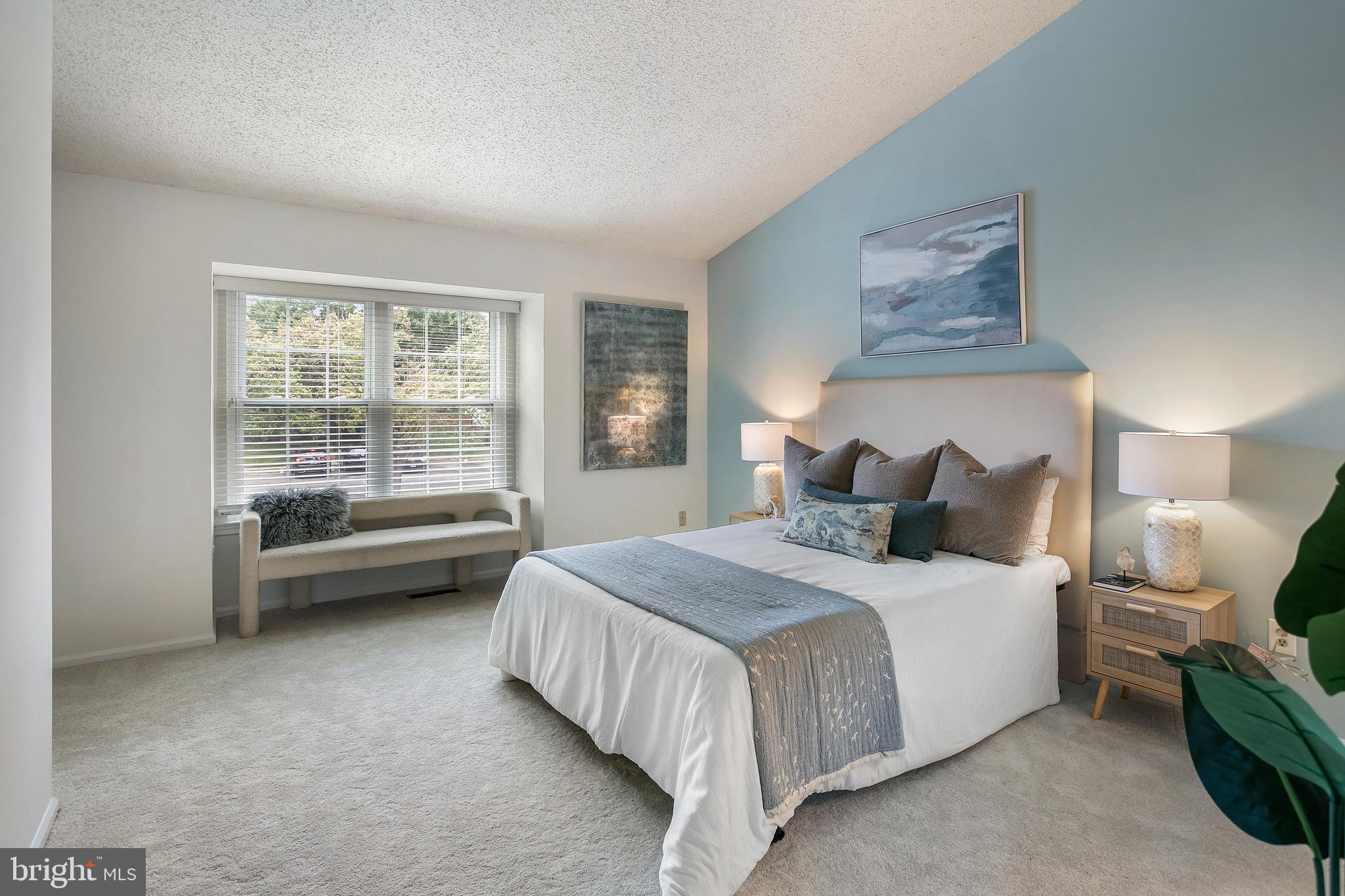 6542 Cypress Point Road Alexandria, VA 22312 - Photo 11 of 31 a bedroom with bed and a couch next to a window