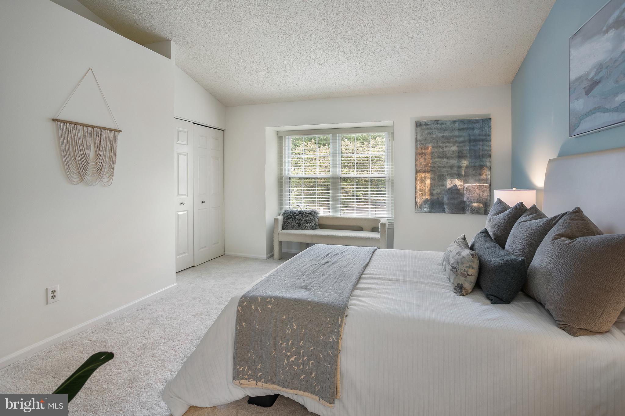 6542 Cypress Point Road Alexandria, VA 22312 - Photo 12 of 31 a living room with a bed furniture and next to a window