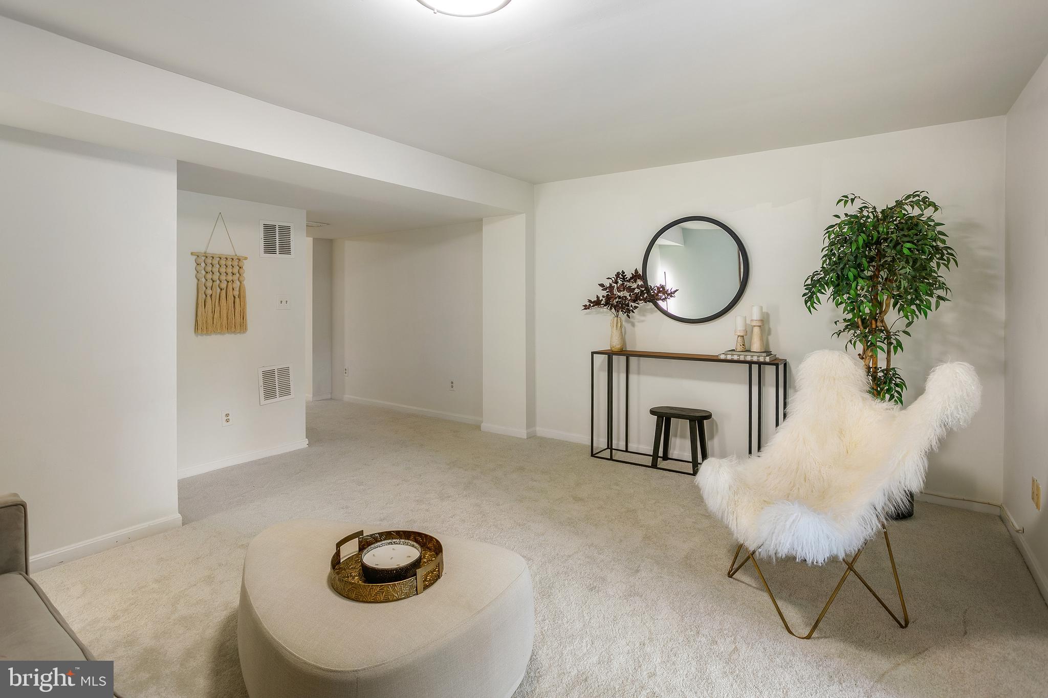 6542 Cypress Point Road Alexandria, VA 22312 - Photo 22 of 31 a living room with furniture a fireplace and a potted plant