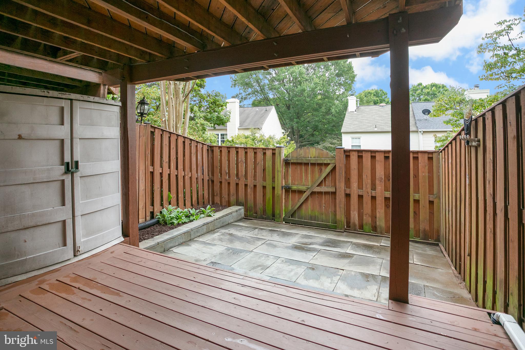 6542 Cypress Point Road Alexandria, VA 22312 - Photo 24 of 31 a view of backyard with wooden floor and iron stairs