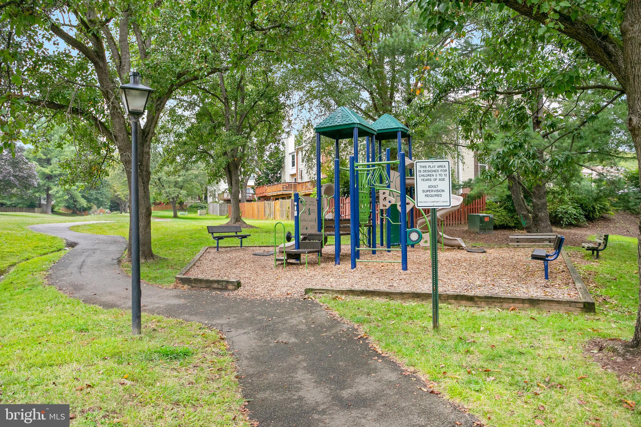 6542 Cypress Point Road Alexandria, VA 22312 - Photo 31 of 31 a front view of a house with garden and plants