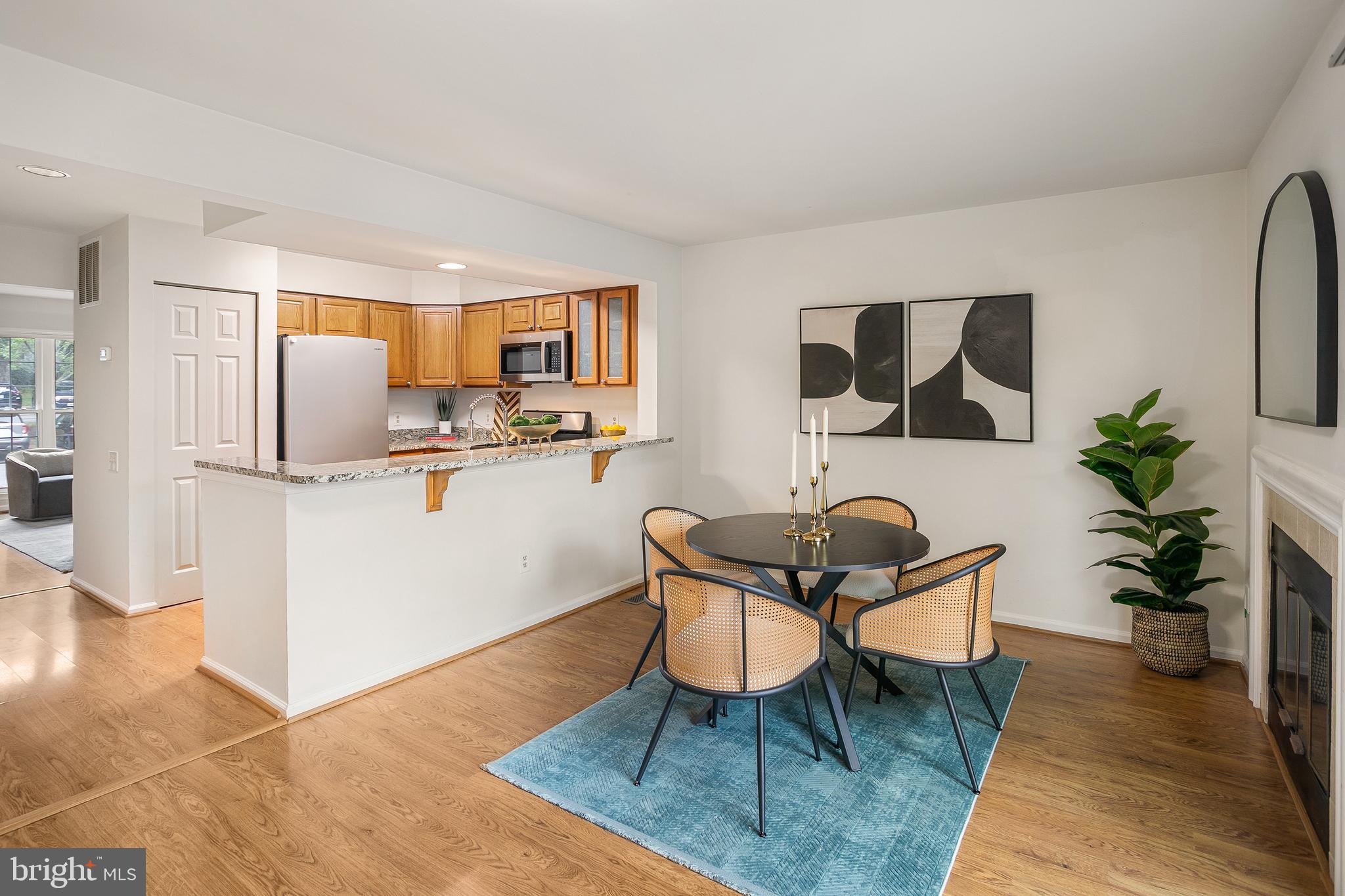 6542 Cypress Point Road Alexandria, VA 22312 - Photo 7 of 31 a living room with furniture and a rug