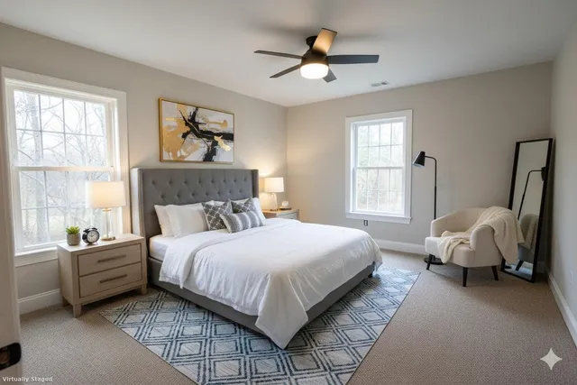 a bedroom with a bed couch and window