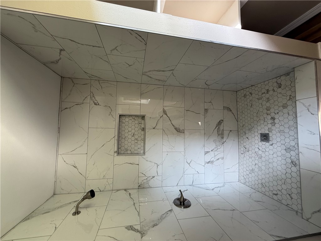 2106 Military Road Dardanelle, AR 72834 - Photo 7 of 16 Primary bathroom walk in shower with beautiful tile.