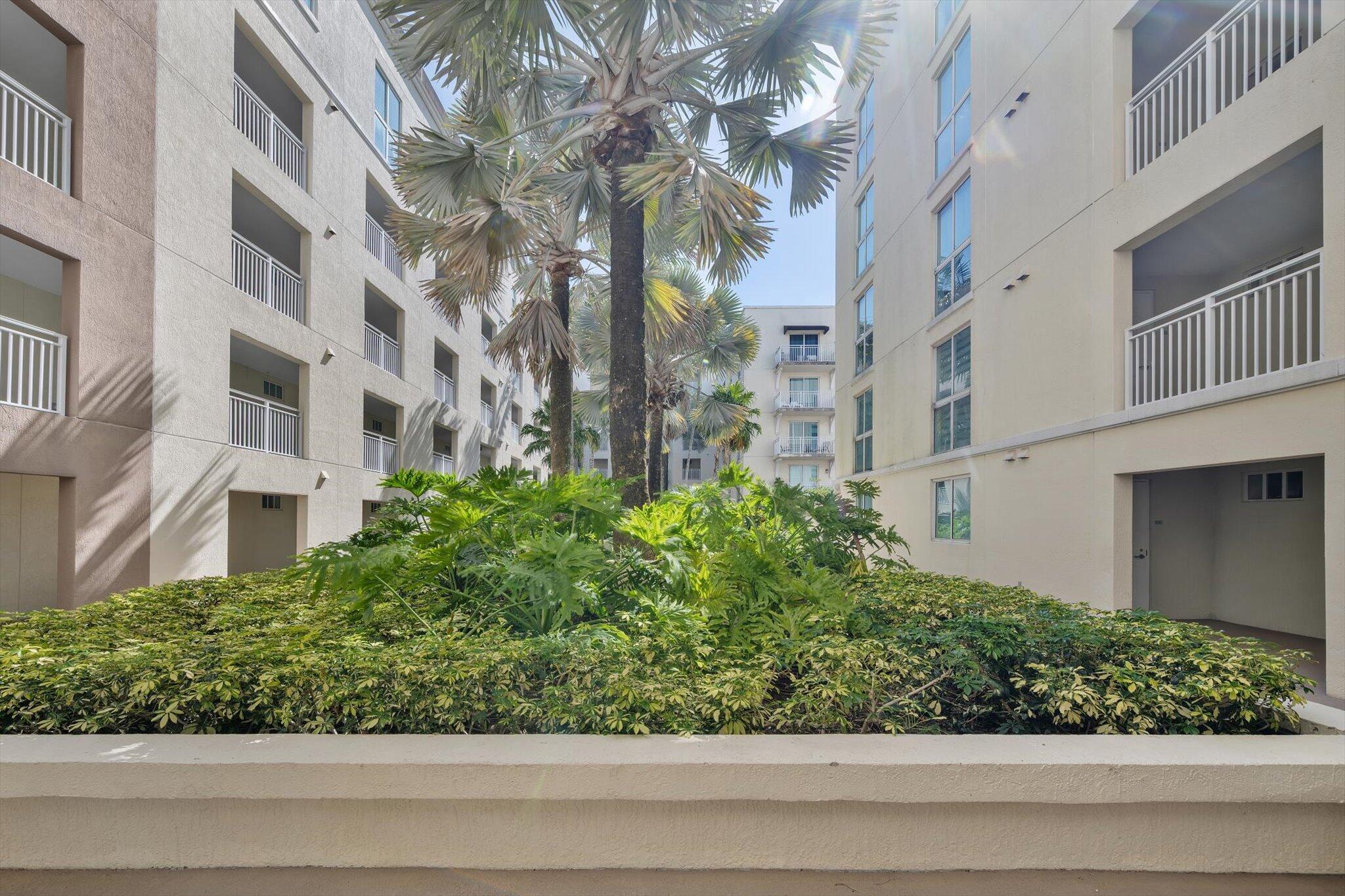7270 Southwest 88th Street, Unit B203 Miami, FL 33156 - Photo 22 of 27 a view of a garden