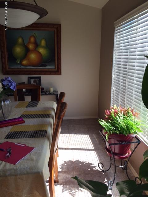1770 Guess Court Rio Rico, AZ 85648 - Photo 3 of 13 a living room with furniture and a flat screen tv