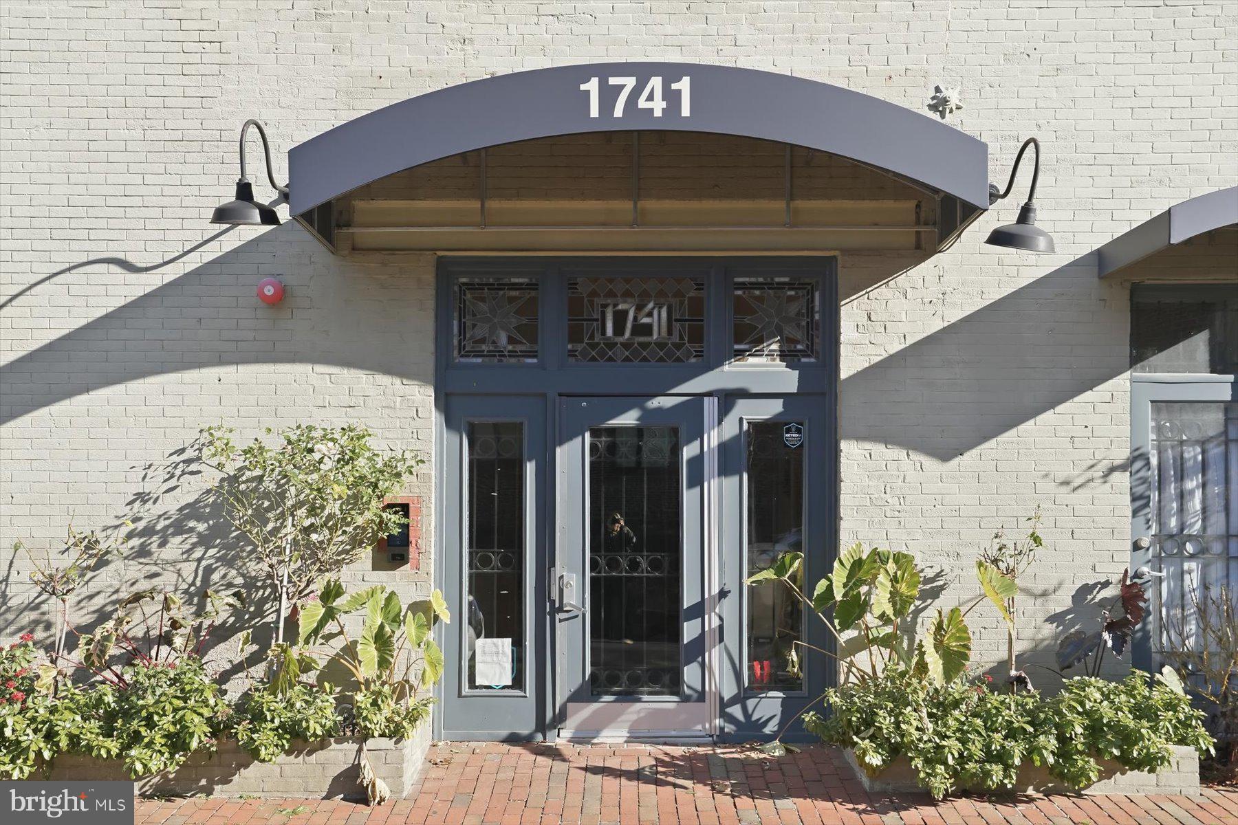 1741 Johnson Avenue Northwest, Unit 302 Washington, DC 20009 - Photo 3 of 24 a front view of a house