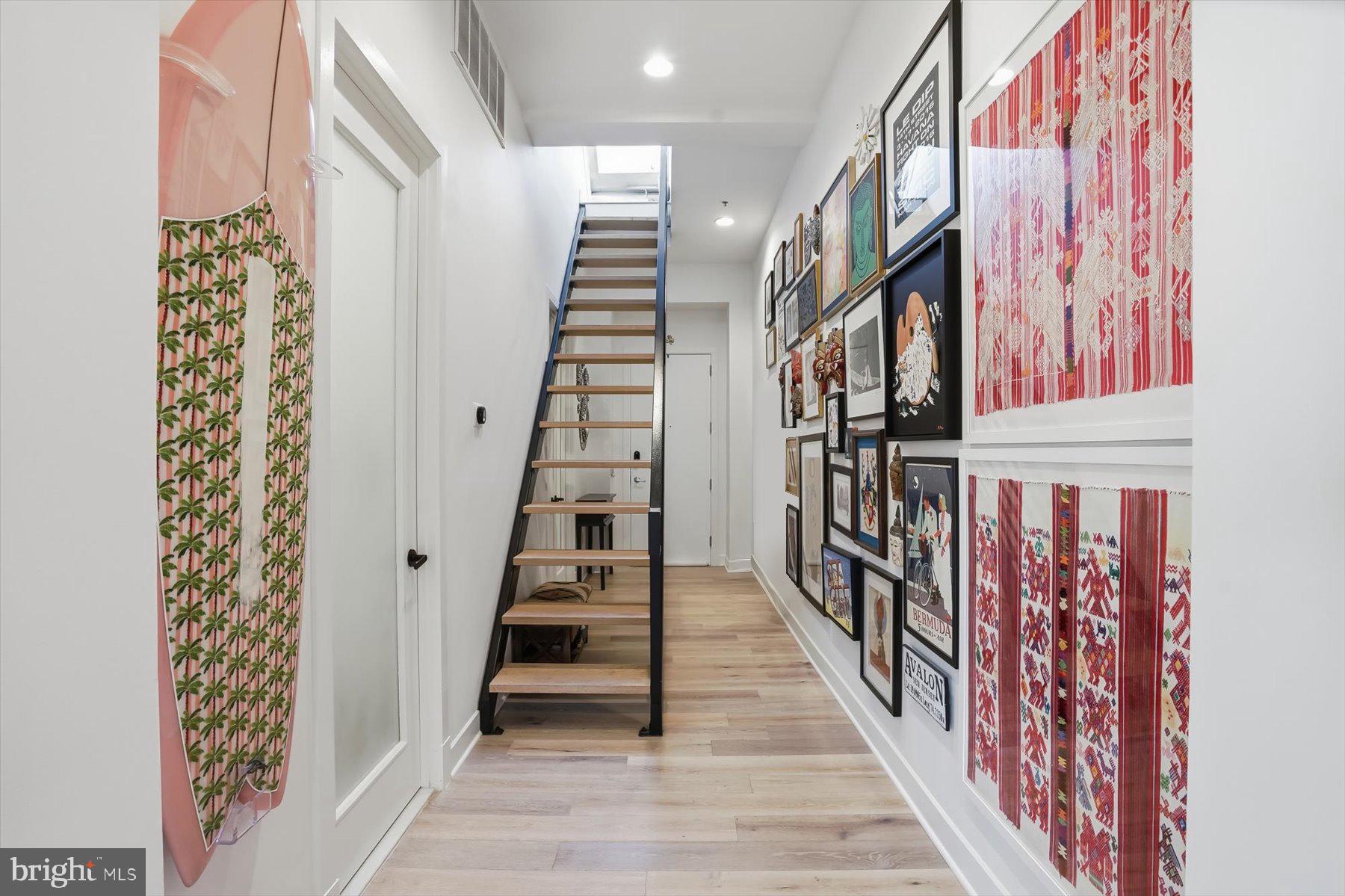 1741 Johnson Avenue Northwest, Unit 302 Washington, DC 20009 - Photo 4 of 24 a view of entryway with wooden floor and stairs