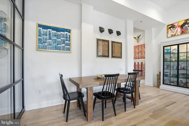 a view of a dining room with furniture and wooden floor