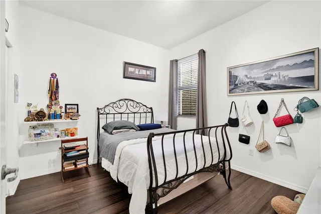 a bed room with a bed and a window