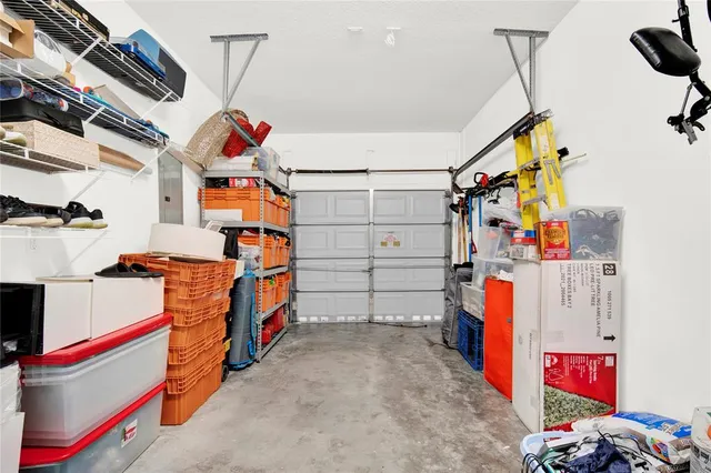 a front view of a house with garden and plants
