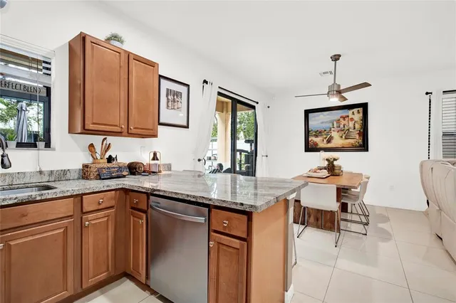 a kitchen with stainless steel appliances granite countertop a sink and cabinets