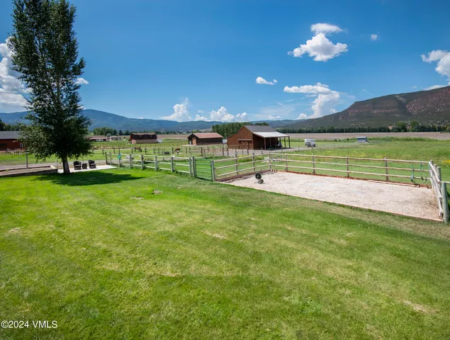 a view of a park with houses