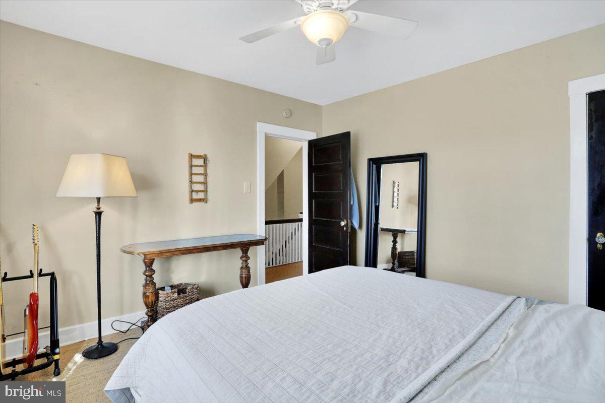 309 Sunset Road Reading, PA 19611 - Photo 15 of 31 a bedroom with a bed and a lamp