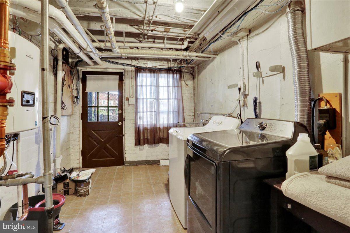 309 Sunset Road Reading, PA 19611 - Photo 25 of 31 a utility room with a sink washer and dryer