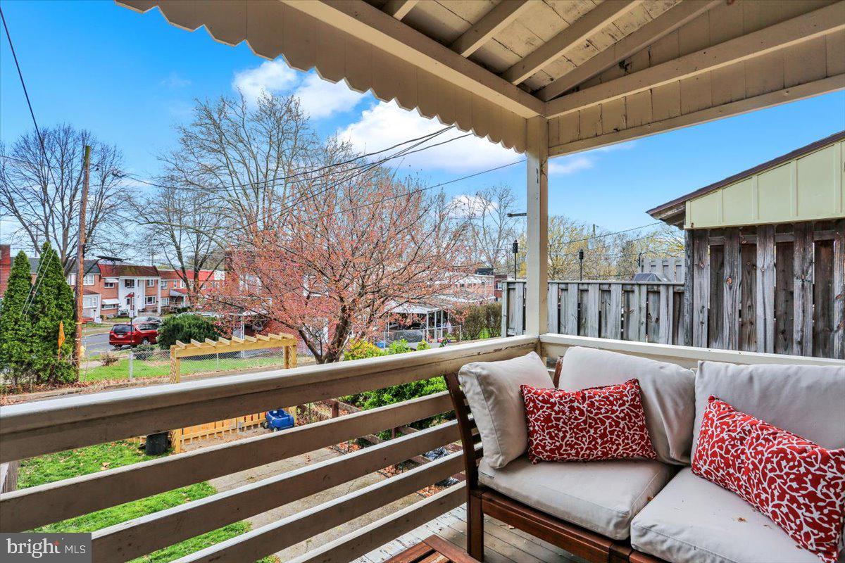 309 Sunset Road Reading, PA 19611 - Photo 30 of 31 a roof deck with a couch and wooden fence