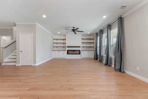 a view of a kitchen with a sink and a refrigerator