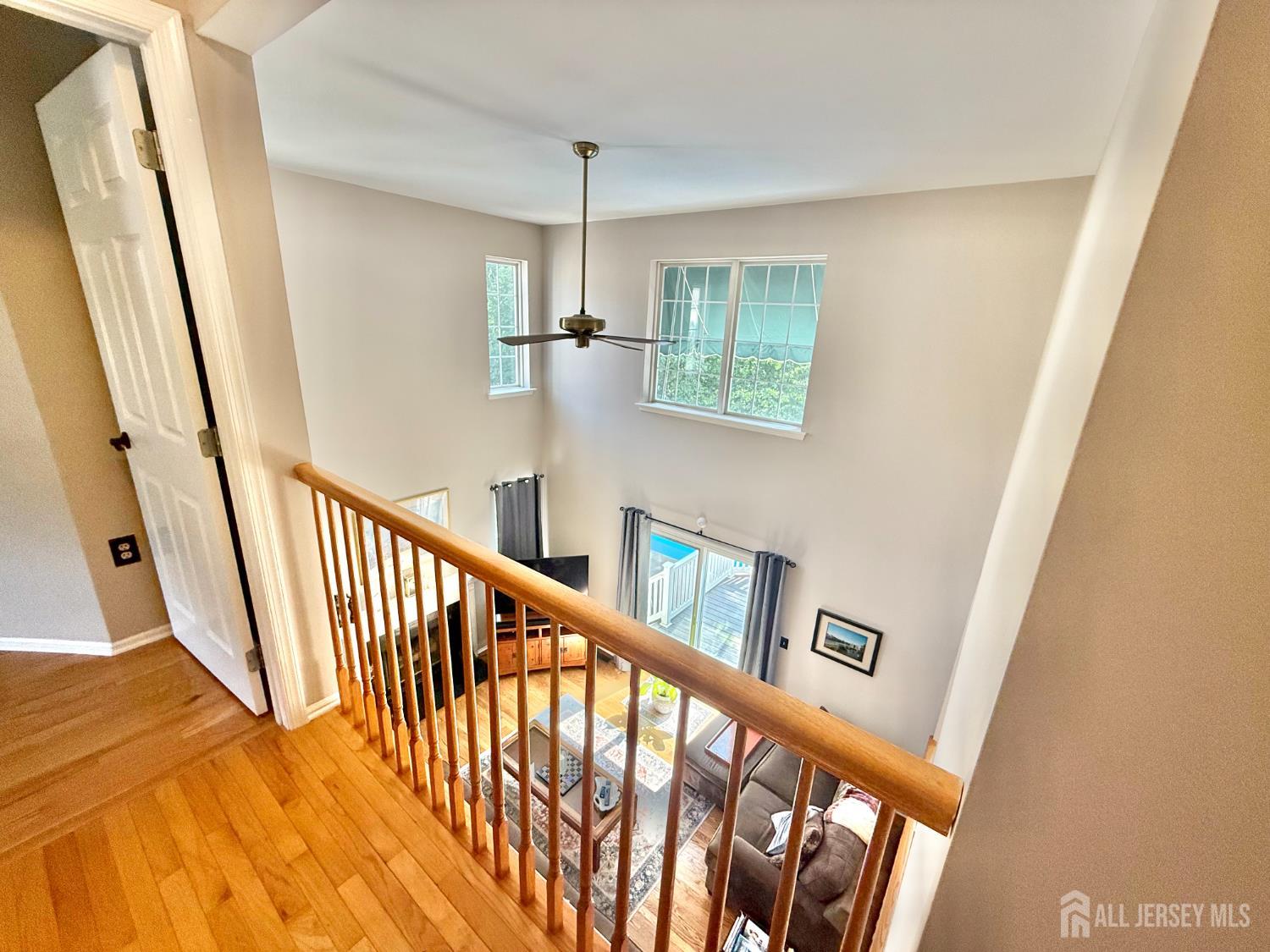 44 Diamond Lane Howell, NJ 07731 - Photo 15 of 35 a view of a hallway with wooden floor and staircase