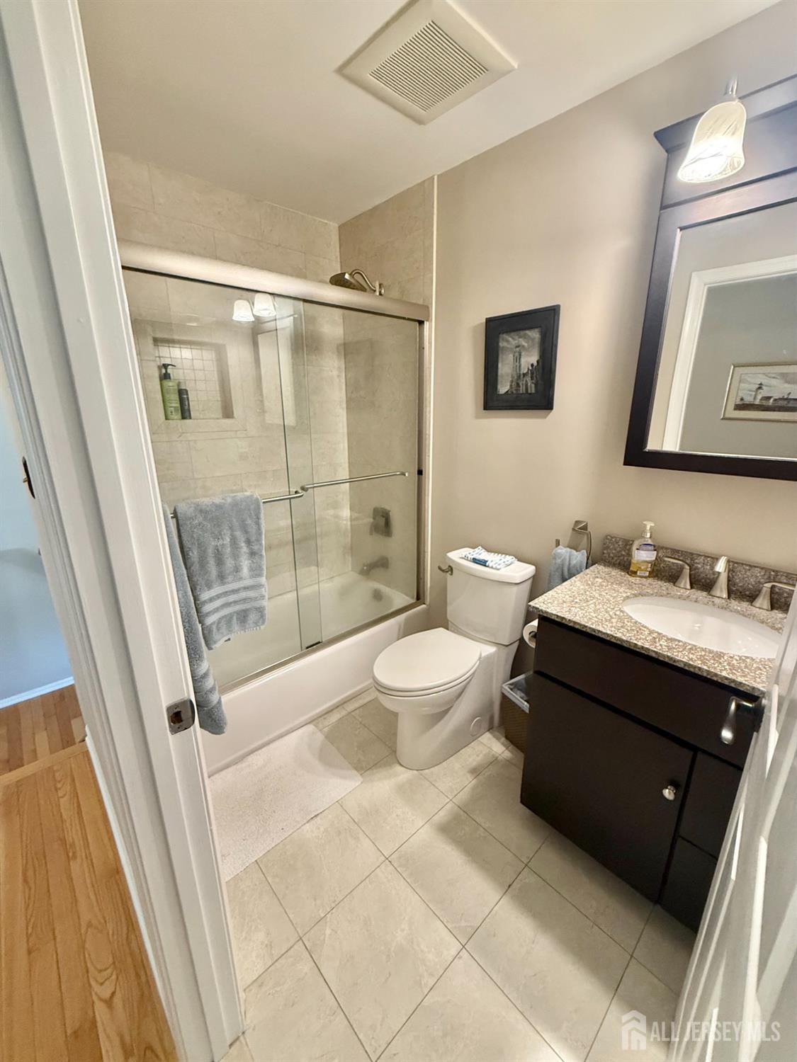 44 Diamond Lane Howell, NJ 07731 - Photo 17 of 35 a bathroom with a double vanity sink toilet and shower