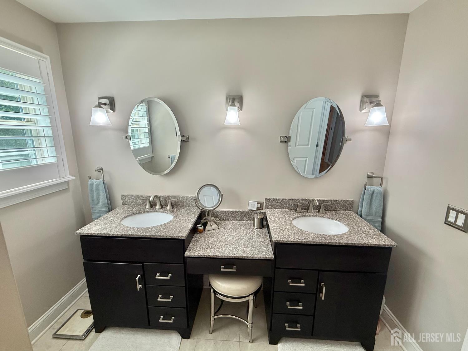 44 Diamond Lane Howell, NJ 07731 - Photo 24 of 35 a bathroom with a double vanity sink and a mirror