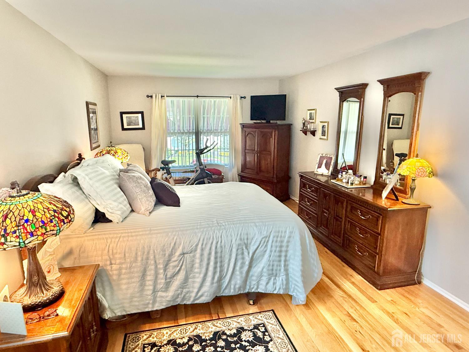 44 Diamond Lane Howell, NJ 07731 - Photo 25 of 35 a bedroom with a bed and wooden floor