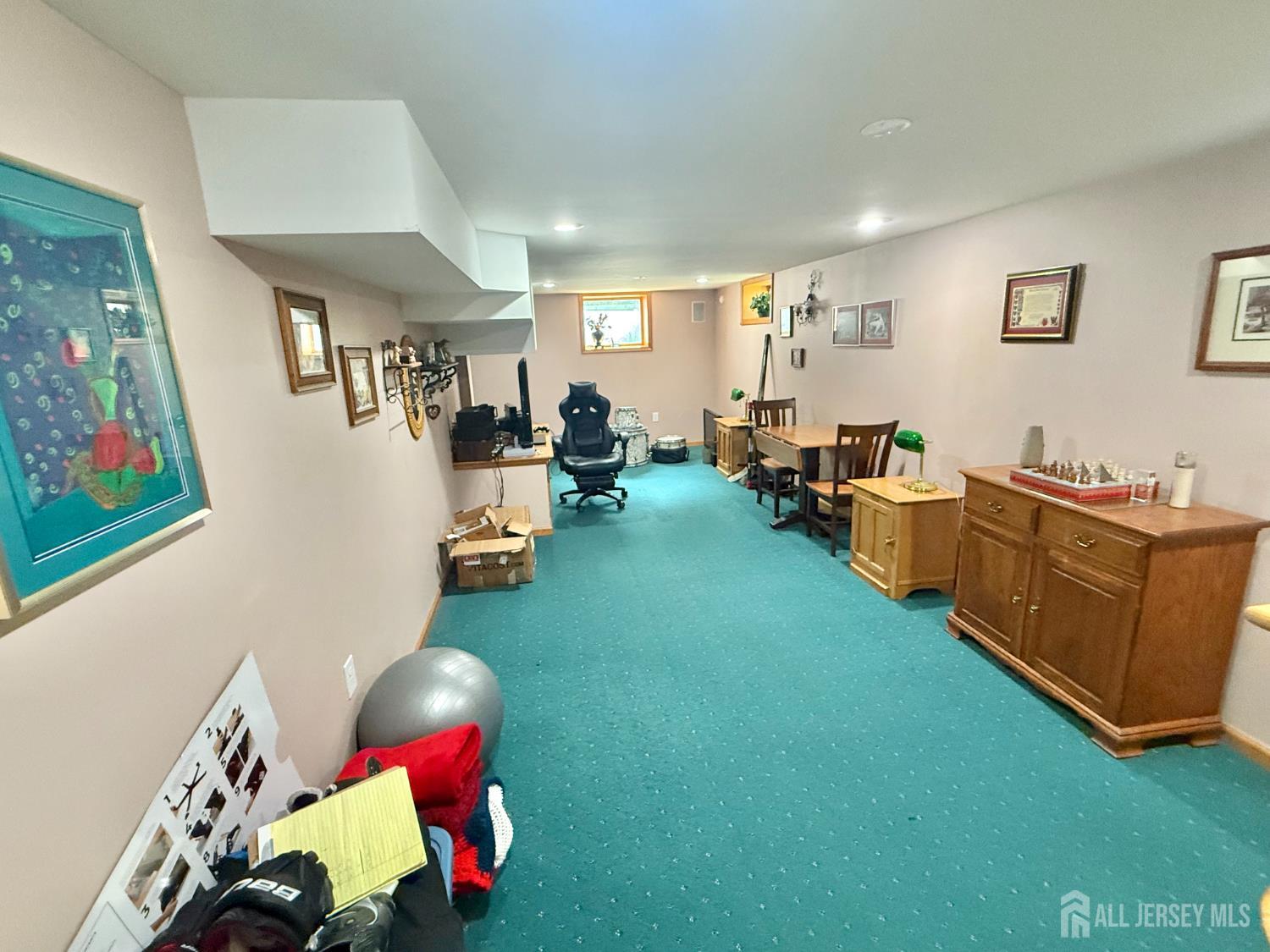 44 Diamond Lane Howell, NJ 07731 - Photo 28 of 35 a living room with furniture and a flat screen tv