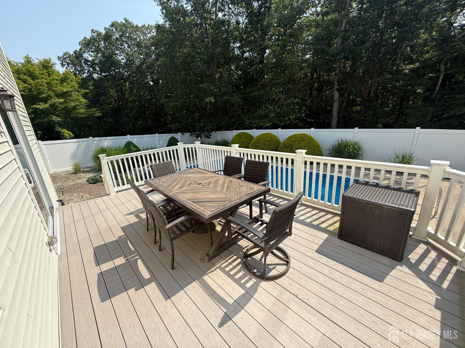 44 Diamond Lane Howell, NJ 07731 - Photo 33 of 35 a view of deck with table and chairs and wooden floor