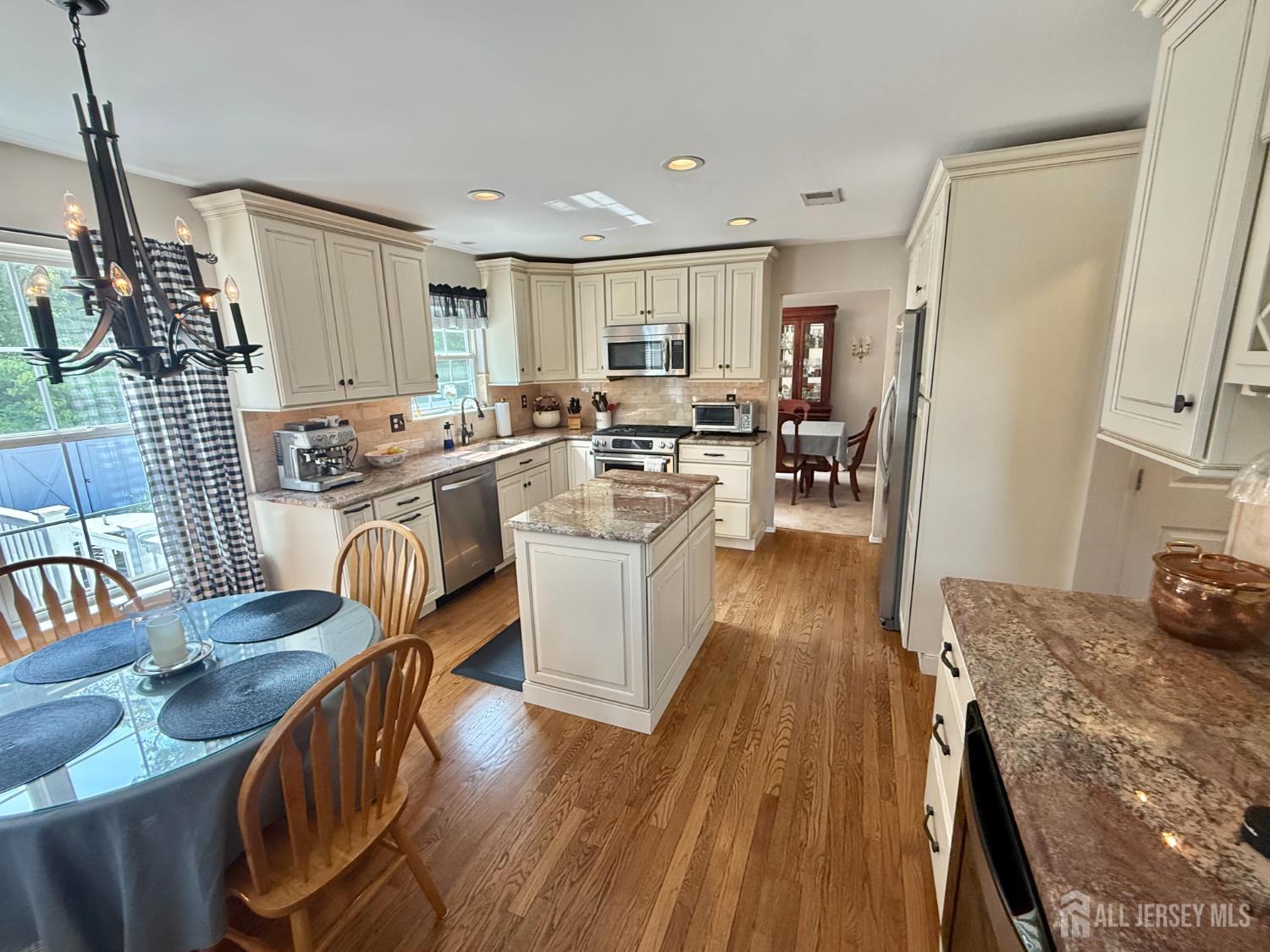 44 Diamond Lane Howell, NJ 07731 - Photo 5 of 35 a living room with furniture and a wooden floor