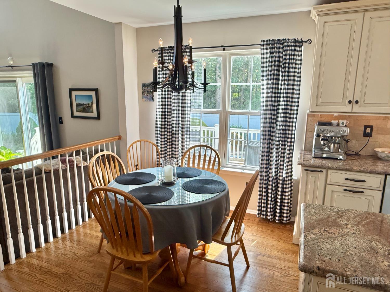 44 Diamond Lane Howell, NJ 07731 - Photo 9 of 35 a dining room with furniture a window and wooden floor
