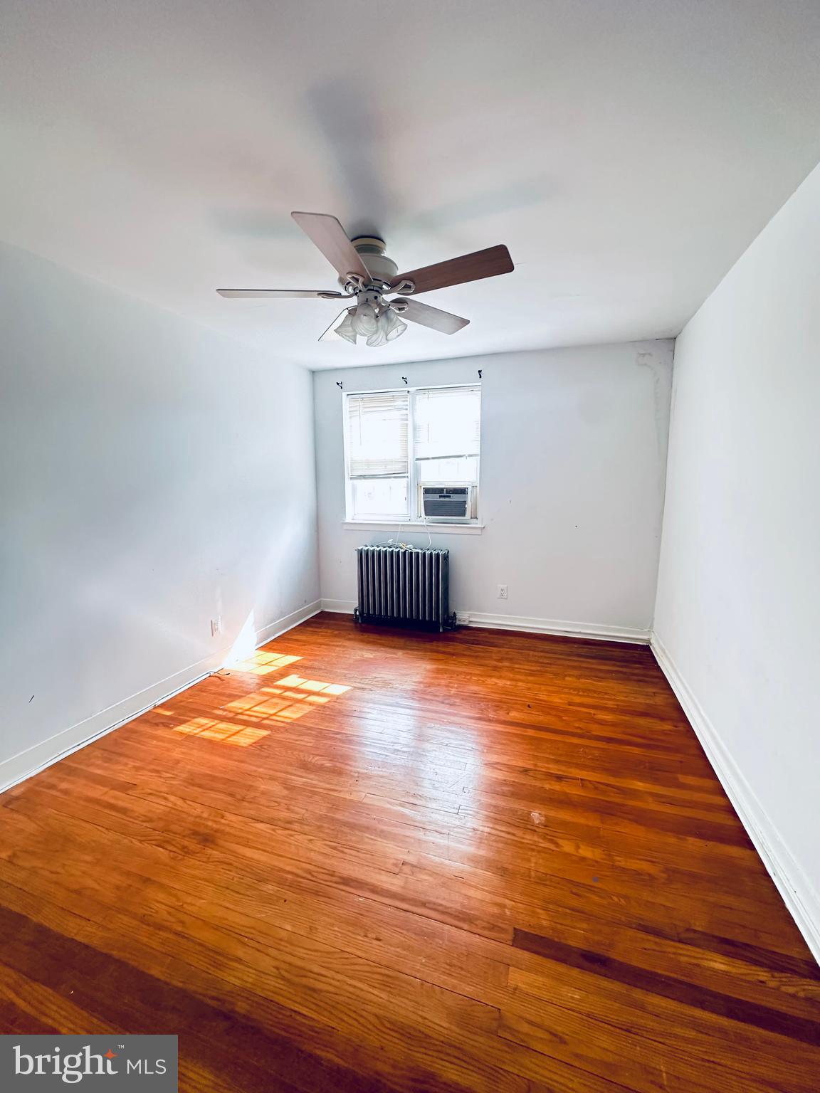 3804 Brooklyn Avenue Baltimore, MD 21225 - Photo 16 of 26 a view of empty room with wooden floor
