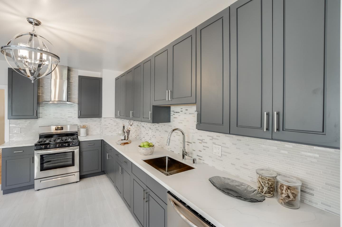 31-33 Boardman Place San Francisco, CA 94103 - Photo 15 of 35 a kitchen with stainless steel appliances a sink a stove and cabinets