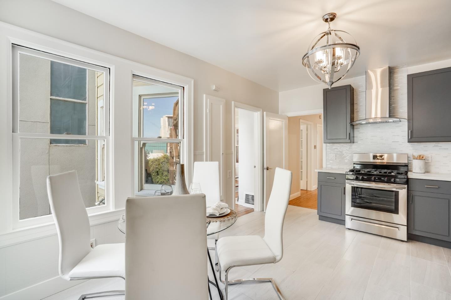 31-33 Boardman Place San Francisco, CA 94103 - Photo 16 of 35 a view of a dining room with furniture a chandelier and wooden floor