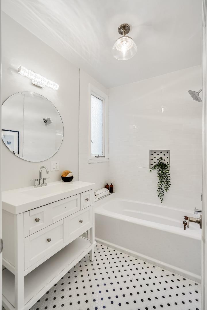 31-33 Boardman Place San Francisco, CA 94103 - Photo 20 of 35 a bathroom with a bathtub a sink and a mirror