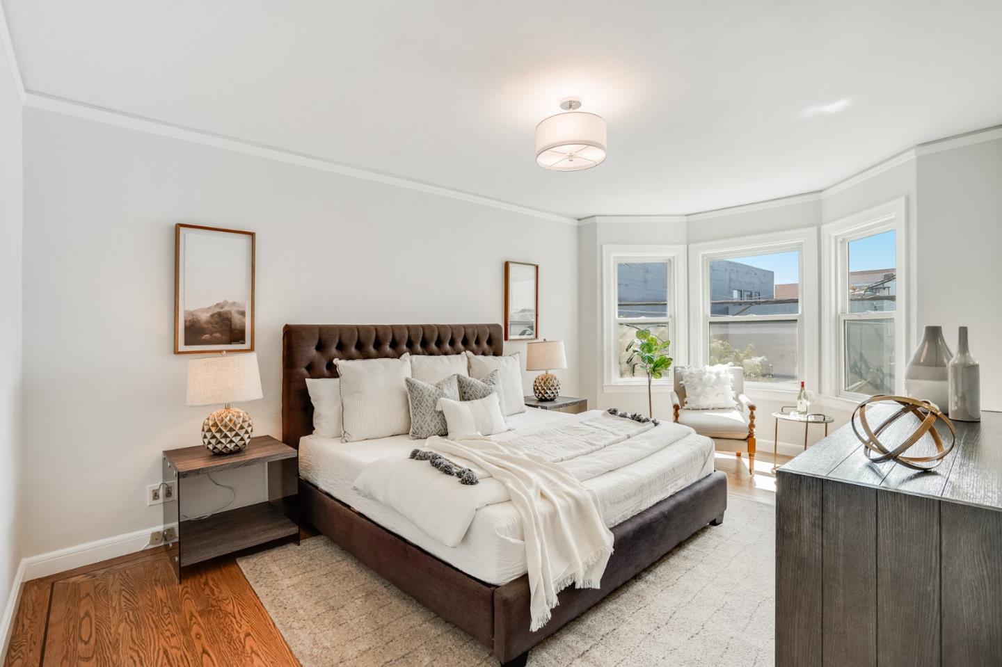 31-33 Boardman Place San Francisco, CA 94103 - Photo 22 of 35 a spacious bedroom with a bed and a large window