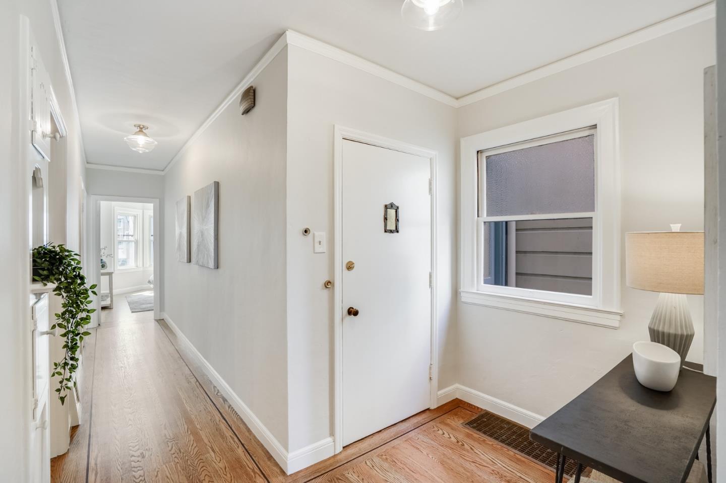 31-33 Boardman Place San Francisco, CA 94103 - Photo 7 of 35 a hallway with wooden floor and windows