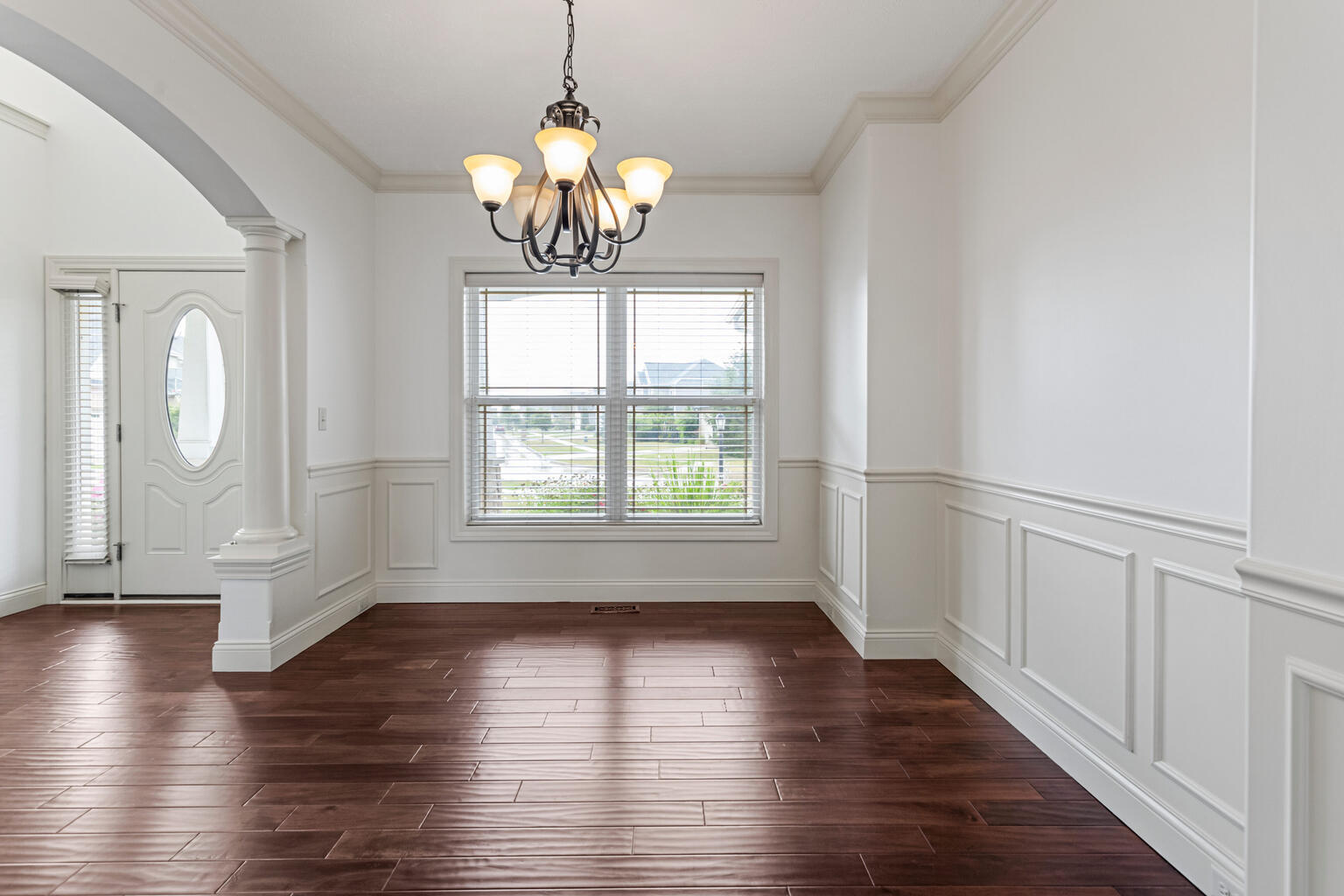5102 Jacks Boulevard Champaign, IL 61822 - Photo 14 of 40 a view of an empty room with wooden floor and a window