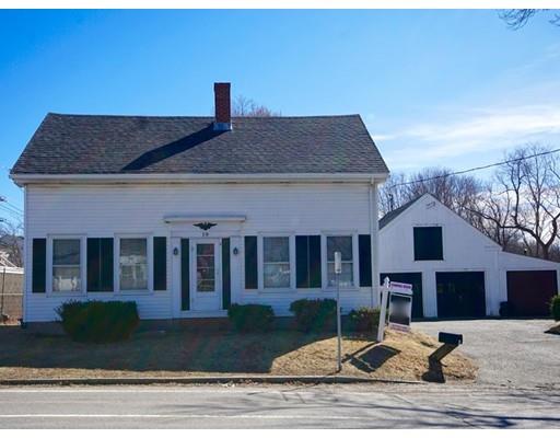 a front view of a house with yard