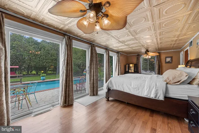 a bedroom with a large bed and balcony view