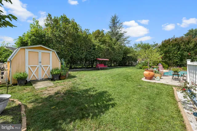 a view of a backyard with sitting area