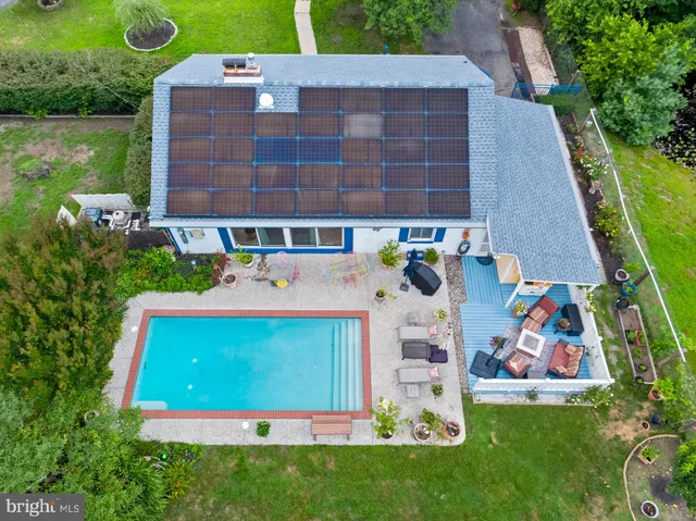 an aerial view of a house with a garden