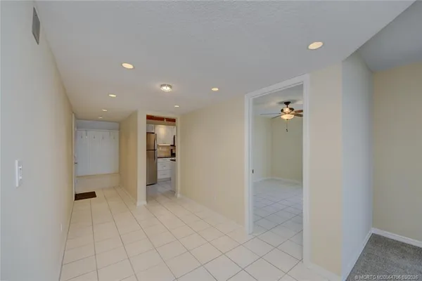 a kitchen with stainless steel appliances granite countertop a refrigerator a stove top oven a sink and dishwasher