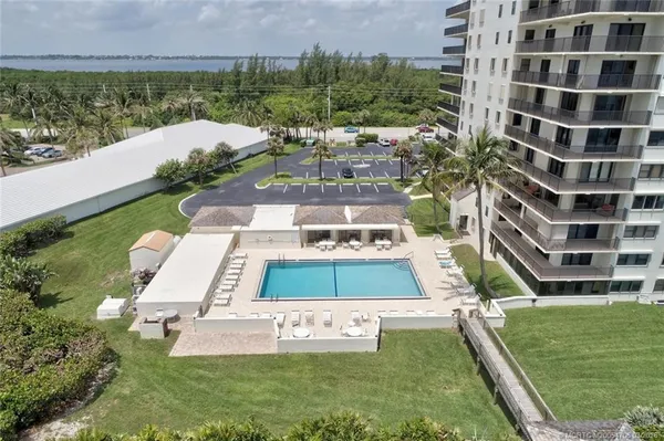 a view of swimming pool with a yard