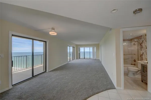 a view of empty room and a fireplace